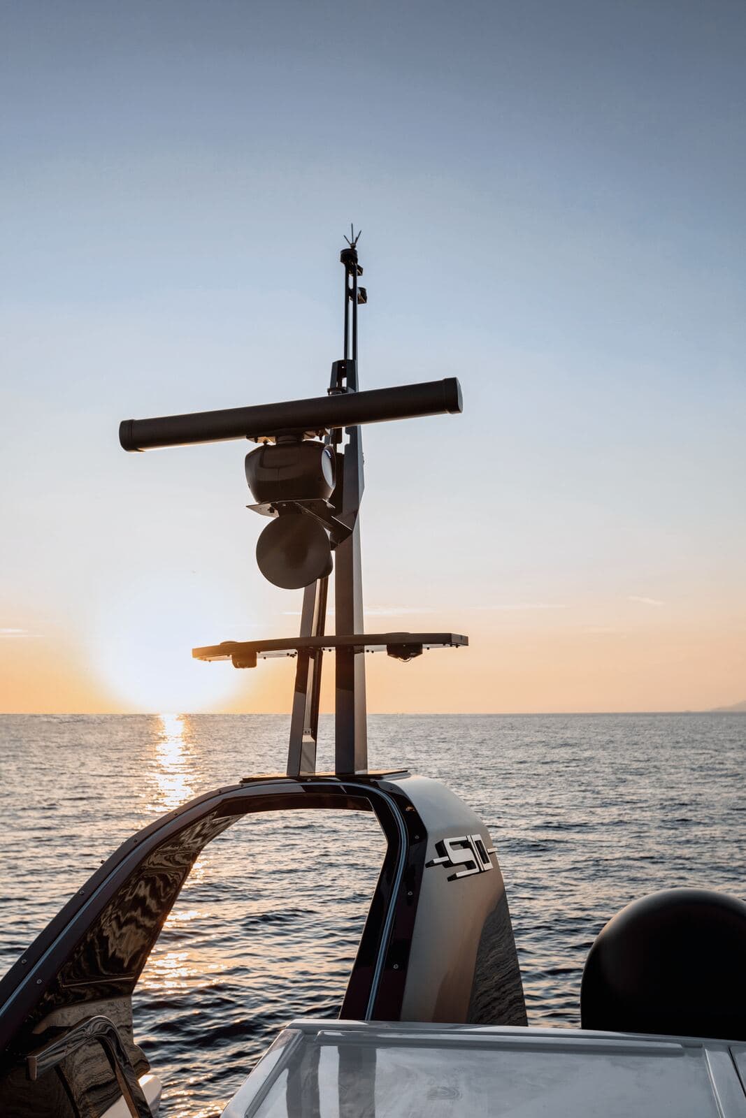 Yacht radar mast against the setting sun